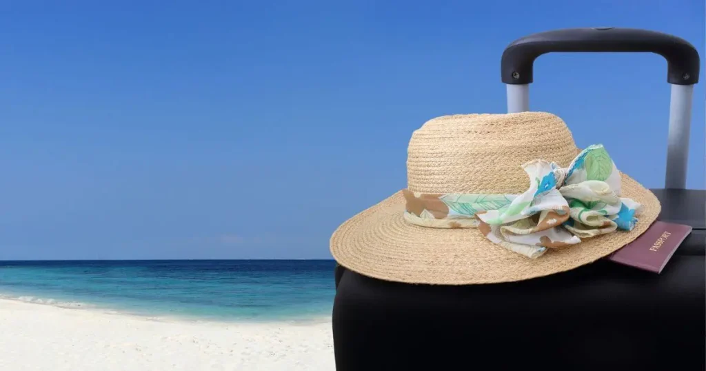 travel bag on beach-travel hacks you need to know